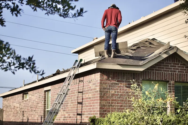 Professional roofer working on a residential roof in Shamrock